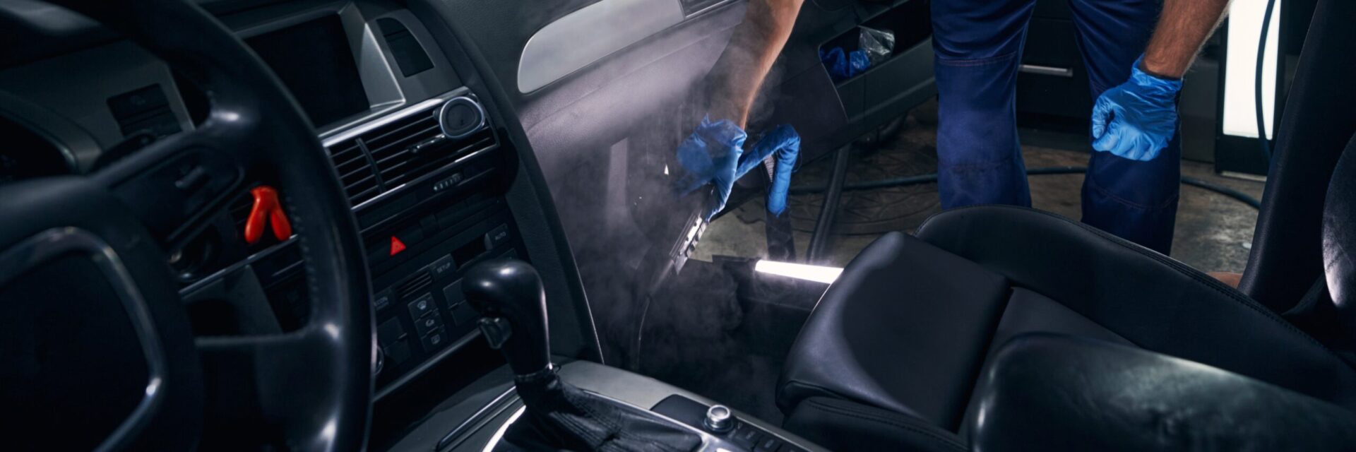 Man Leaning and Dry Cleaning Car Bottom Image